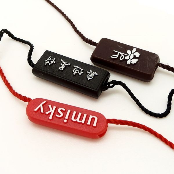 廠家直銷新款通用服裝吊粒吊繩 塑料商標(biāo)吊粒可免費logo設(shè)計